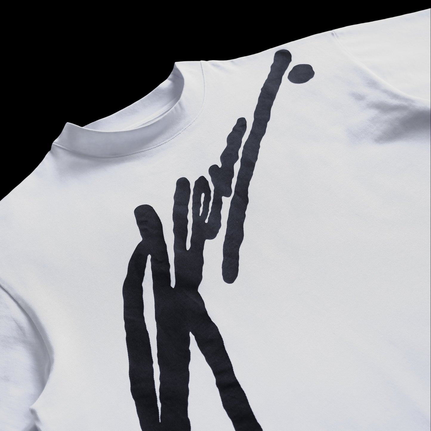 White t-shirt with black abstract design on a white background